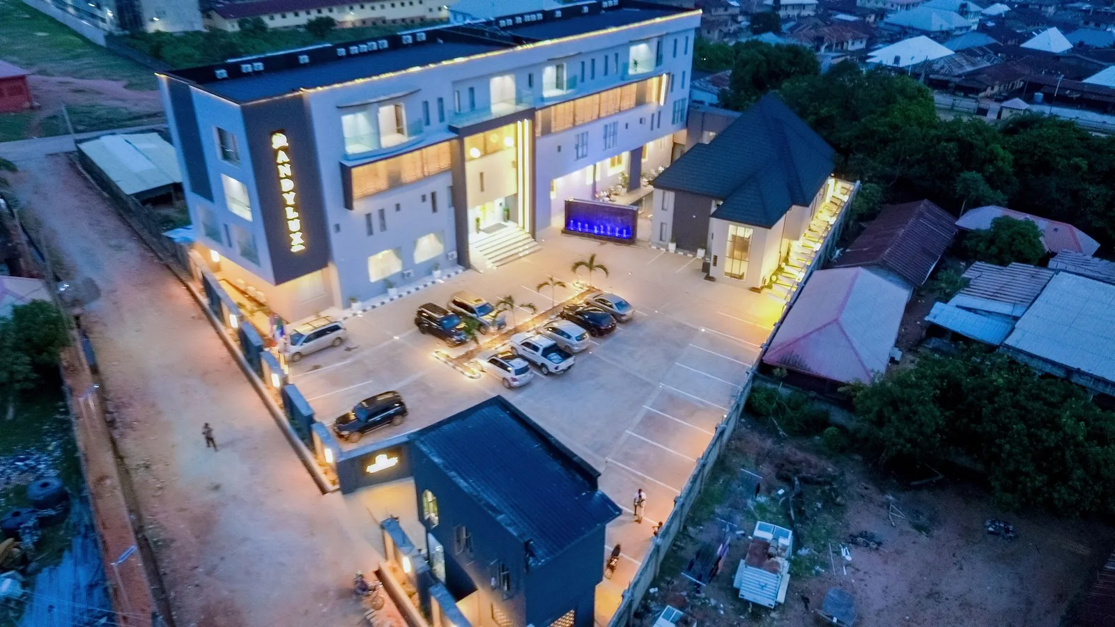 The Andylux compound at night from the air, with the street running alongside