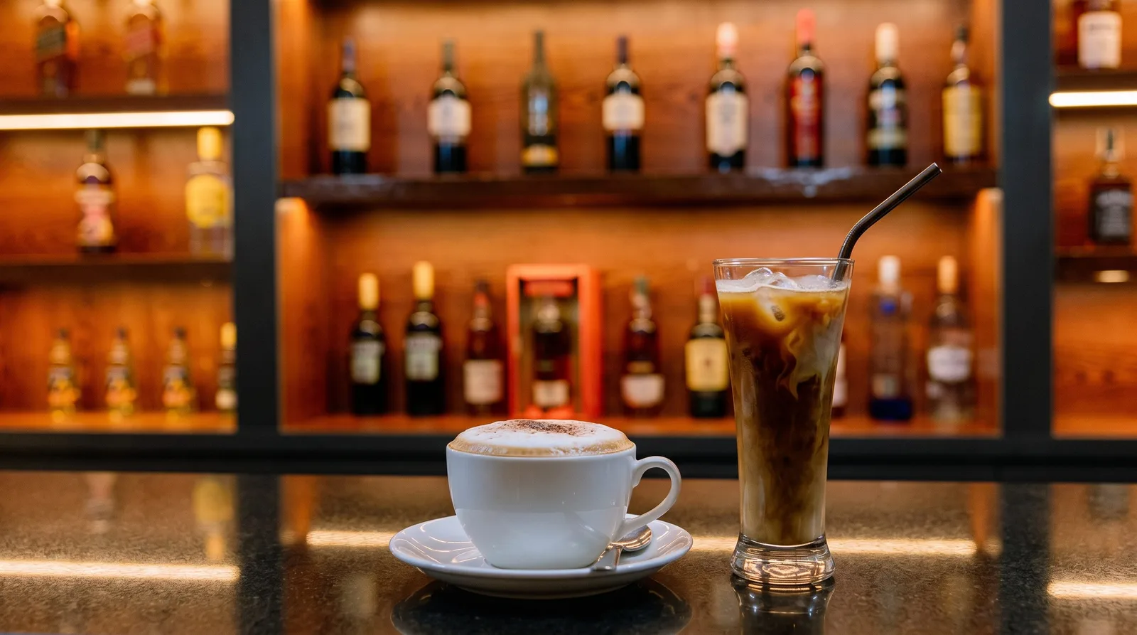 Cappuccino and iced coffee on the bar counter